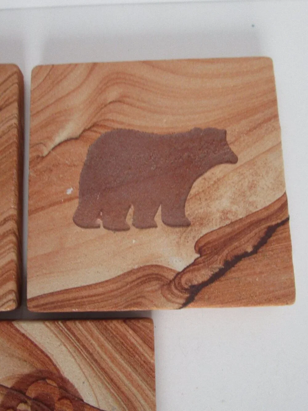 etched sandstone coaster set